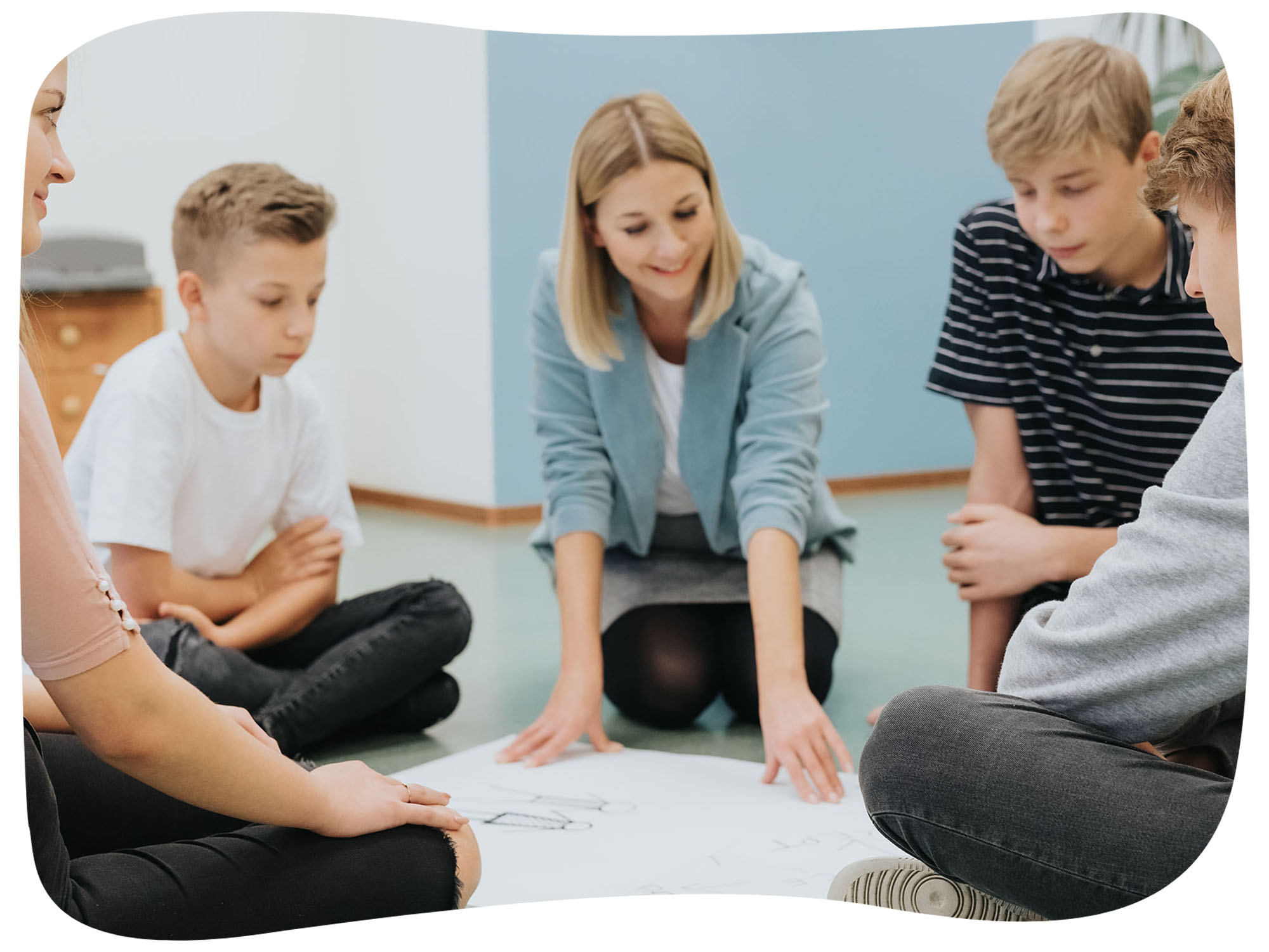 base_0000s_0003_base_0008_teenagers-sit-in-a-circle-on-the-floor-and-prepare-2024-10-20-17-02-03-utc